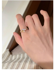 Detailed view of s925 silver ring with colorful gemstones and pearls in floral design