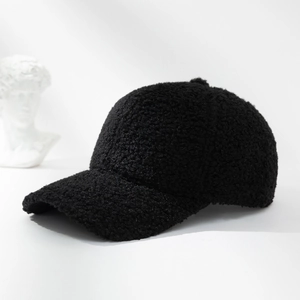 Classic black teddy fleece baseball cap for women with warm winter texture on white background