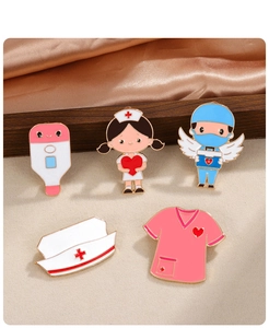 Close-up of nurse and doctor enamel pins with stethoscope and thermometer details