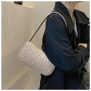 Shoulder bag in creamy white PU leather with wave embossed texture and zipper closure