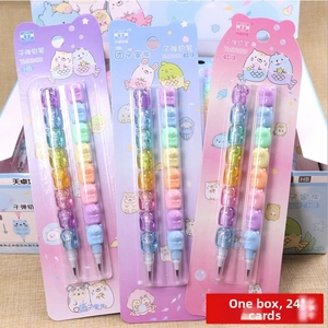 Close-up of colorful cartoon stackable pencils set in independent card packaging for school
