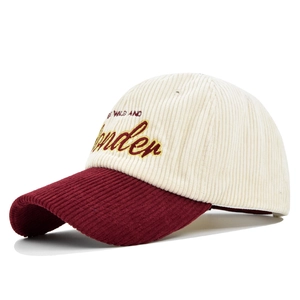 Corduroy baseball cap with cream crown, red brim and embroidered Wonder slogan