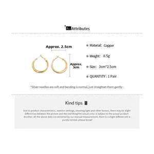 Detail showing twisted gold hoops with dimensions 3cm by 2.5cm and silver pin info