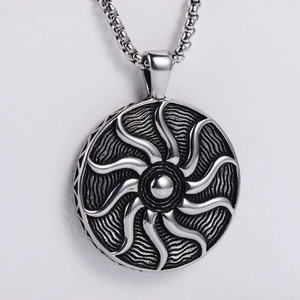 Detailed macro view of hiphop sun flower pendant with spiral textures on silver steel