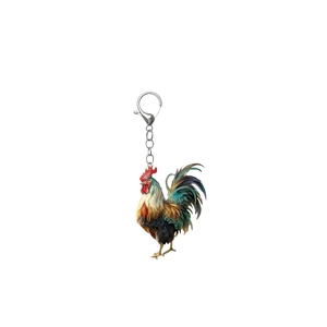 Detail of colorful acrylic rooster keychain with vivid feathers on white background