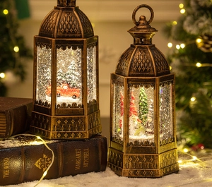 Detail of a vintage bronze Christmas lantern with LED snow scene and red truck inside