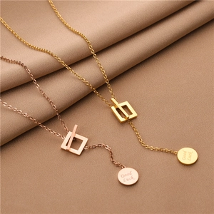 Titanium steel necklaces with Good Luck charms in gold and rose gold finishes