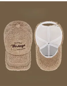 Detail view of khaki faux shearling baseball cap with vintage embroidery and inner lining