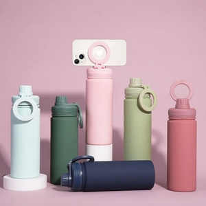 Detail of multi-color matte sport bottles featuring innovative flip-up phone holder lids