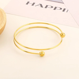 Minimalist double-layered gold stainless steel open bangle with smooth ball accents