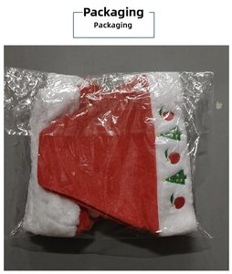 Detail of plush Christmas hat packaging showing festive tree and apple embroidery