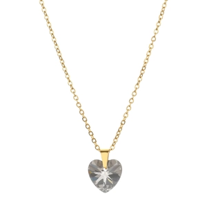 Close-up of heart-shaped zircon pendant on golden stainless steel necklace chain