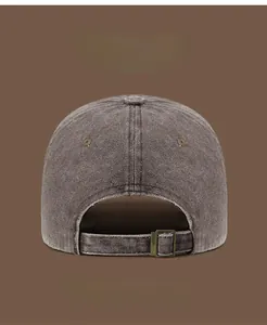 Close-up of vintage washed baseball cap back with adjustable bronze metal buckle