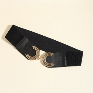 Detail of a black elastic waist belt with a golden metal buckle and spiral texture