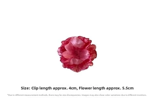 Detailed view showing a 3D satin rose flower hair claw in elegant red and pink colors