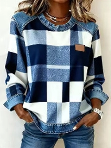 Detail of plaid denim patchwork texture and round neck design on women's sweatshirt