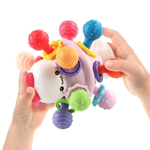 Colorful baby sensory rattle ball with textured nubs for fine motor skill development