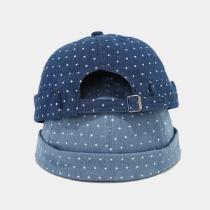 Detail of blue denim miki hats with white polka dots and adjustable metal buckle back