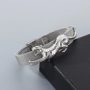 Macro detail of silver cheetah stainless steel mesh bracelet with adjustable strap