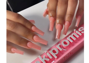 Detail of pink gradient press-on nails with glitter texture and geometric lines