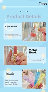 Close-up of unicorn oil-filled liquid sand cup keychain with Happy Moments PVC strap