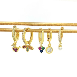 Detailed view of 5-piece gold-plated hoop earring set with zircon charms and pearls