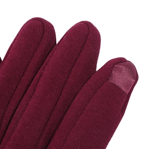 Detail of touchscreen conductive fabric on fingertip of burgundy winter fleece gloves