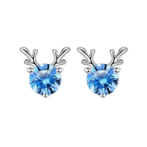 Detail of silver reindeer antler earrings with round blue stones on white background