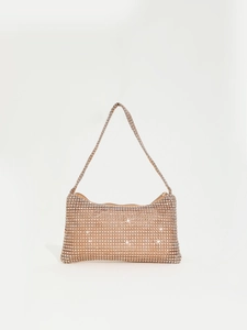 Macro detail of champagne gold rhinestone mesh fabric on an elegant mini hobo bag