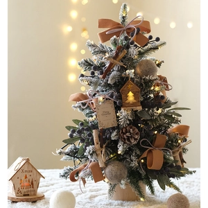 Mini tabletop flocked Christmas tree with bows, ornaments and wood base with LED lights