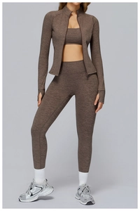 Detailed view of coffee marl yoga set featuring thumb hole cuffs and ribbed texture