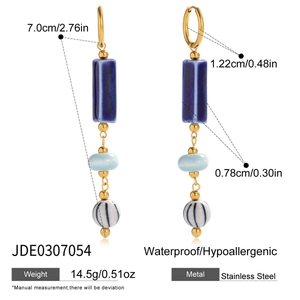 Detail of blue ceramic tassel earrings with waterproof stainless steel hardware