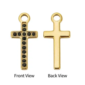 Macro view of gold stainless steel cross pendant with black zircon inlays and smooth back