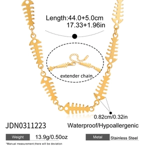 Detail of gold fishbone necklace featuring waterproof stainless steel and adjustable chain