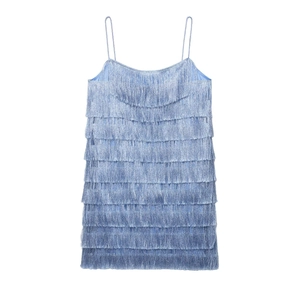 Close-up detail of light blue tiered fringe dress featuring delicate tassel layers