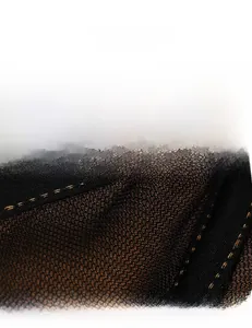 Detail of breathable black honeycomb mesh lining with bronze metallic underlay texture