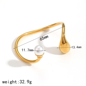 Minimalist gold titanium open cuff bracelet with round pearl and waterdrop charm detail