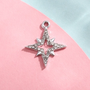 Detail of silver octagonal star pendant with sparkling rhinestones for DIY jewelry