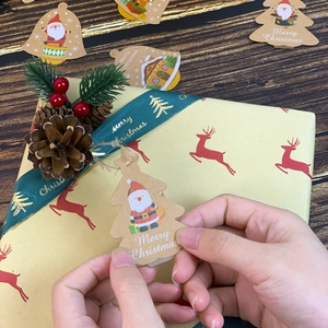 Christmas kraft paper gift tags with Santa and snowman patterns including jute twine
