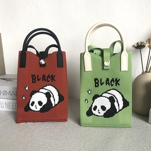 Knitted panda mini handbag in red and green colors with BLACK text pattern for women