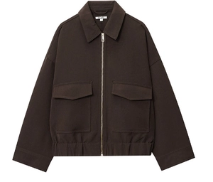 Detail of dark brown casual zip-up jacket with large pockets and elastic hem design