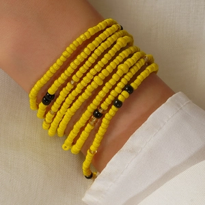 Bohemian colorful handmade beaded body chain with yellow and black layers for summer