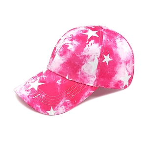 Detail of pink tie-dye baseball cap featuring white star prints and quality stitching