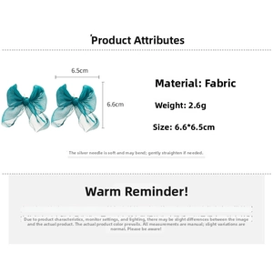 Detail view of dark lake blue lace bow earrings with dimensions 6.6x6.5cm and silver pins