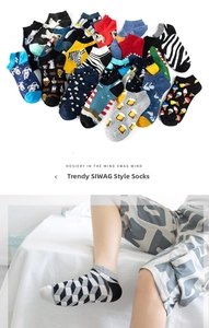 Detailed view of low cut socks with colorful patterns including astronaut and zebra motifs