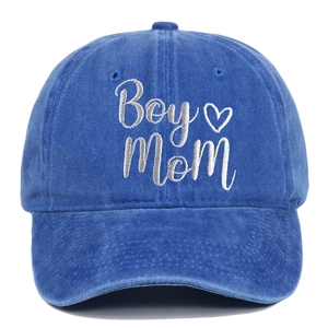 Detailed view of white Boy Mom embroidery and heart on blue washed cotton baseball cap