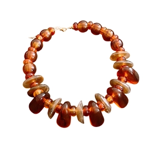 Maillard style acrylic irregular oval beaded necklace with amber and marble textures