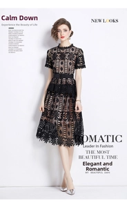 Close-up of elegant black hollow water-soluble lace fabric on a midi dress with belt