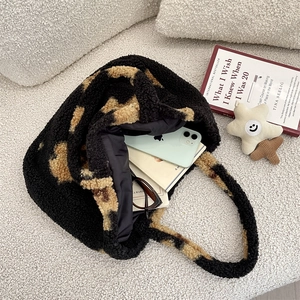 Leopard print faux fur tote bag showing interior storage for books and accessories