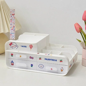 Detail of white multi-grid desktop organizer with cute stickers and dual storage drawers